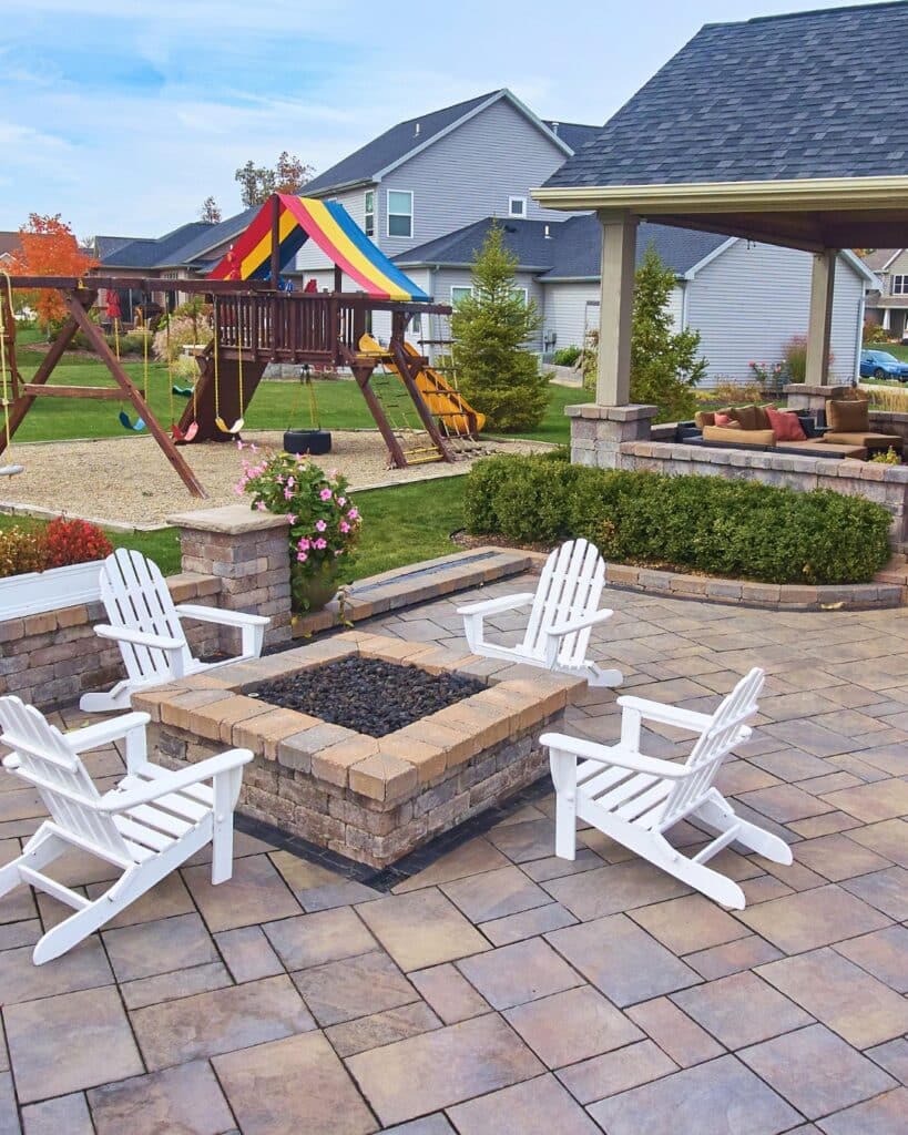Technician winterizing an outdoor firepit in Fort Lupton, CO to prevent winter damage and extend its lifespan